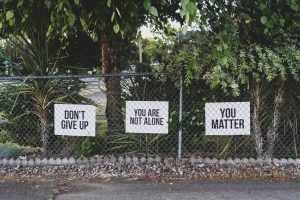 fence with motivation signs